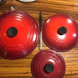 Le Creuset enamel pot lids. Prices vary
